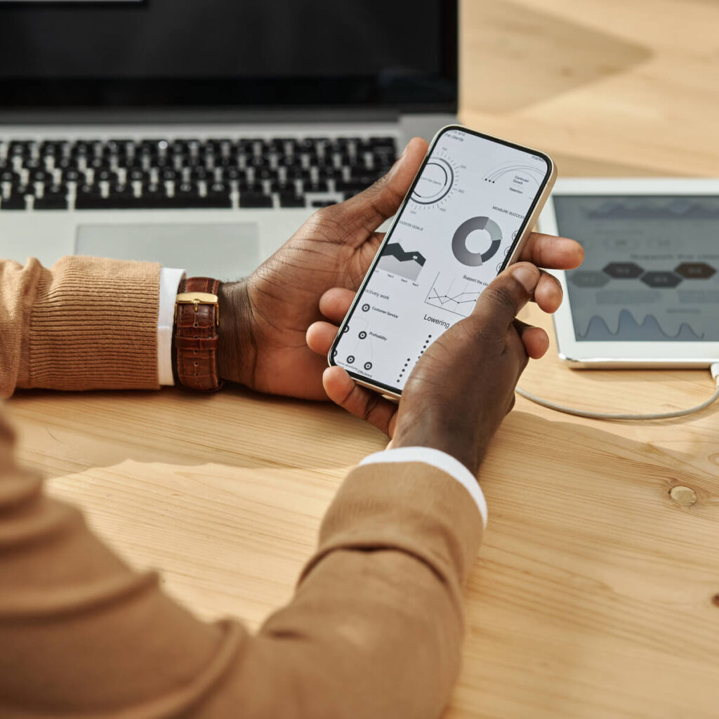 How an LMS Can Transform Your Online Course Business businessman working with financial charts on smart 2023 11 27 05 05 50 utc
