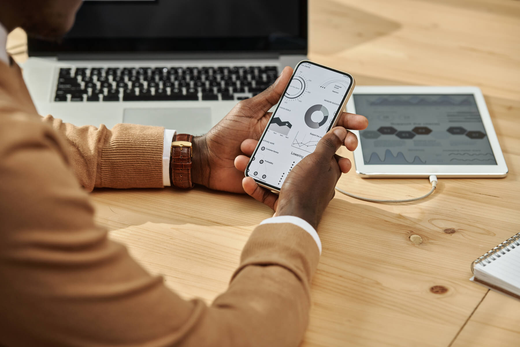 How an LMS Can Transform Your Online Course Business businessman working with financial charts on smart 2023 11 27 05 05 50 utc