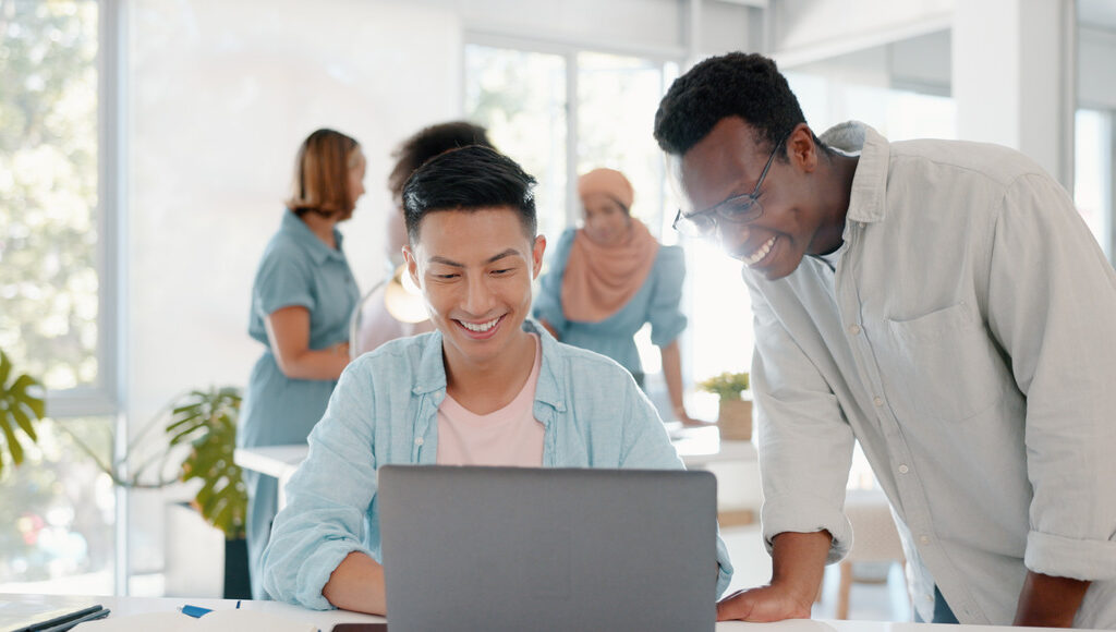 A Guide to Affordable Online Course Solutions fist bump success and people on laptop in office t lbkezr6