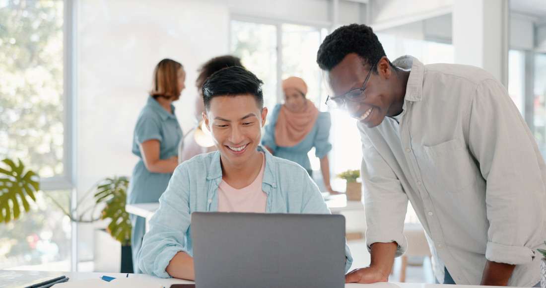 A Guide to Affordable Online Course Solutions fist bump success and people on laptop in office t lbkezr6