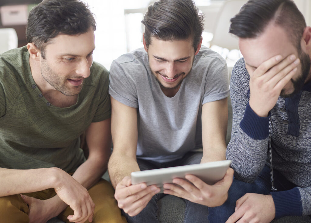 Exploring the Benefits of an LMS for Online Course Instructors friends browsing photos from their old times