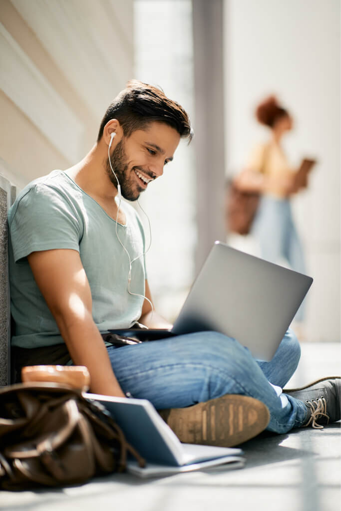 How to Migrate Your Online Courses to a New LMS Seamlessly happy college student learning while using laptop 2023 11 27 04 48 59 utc.jpg